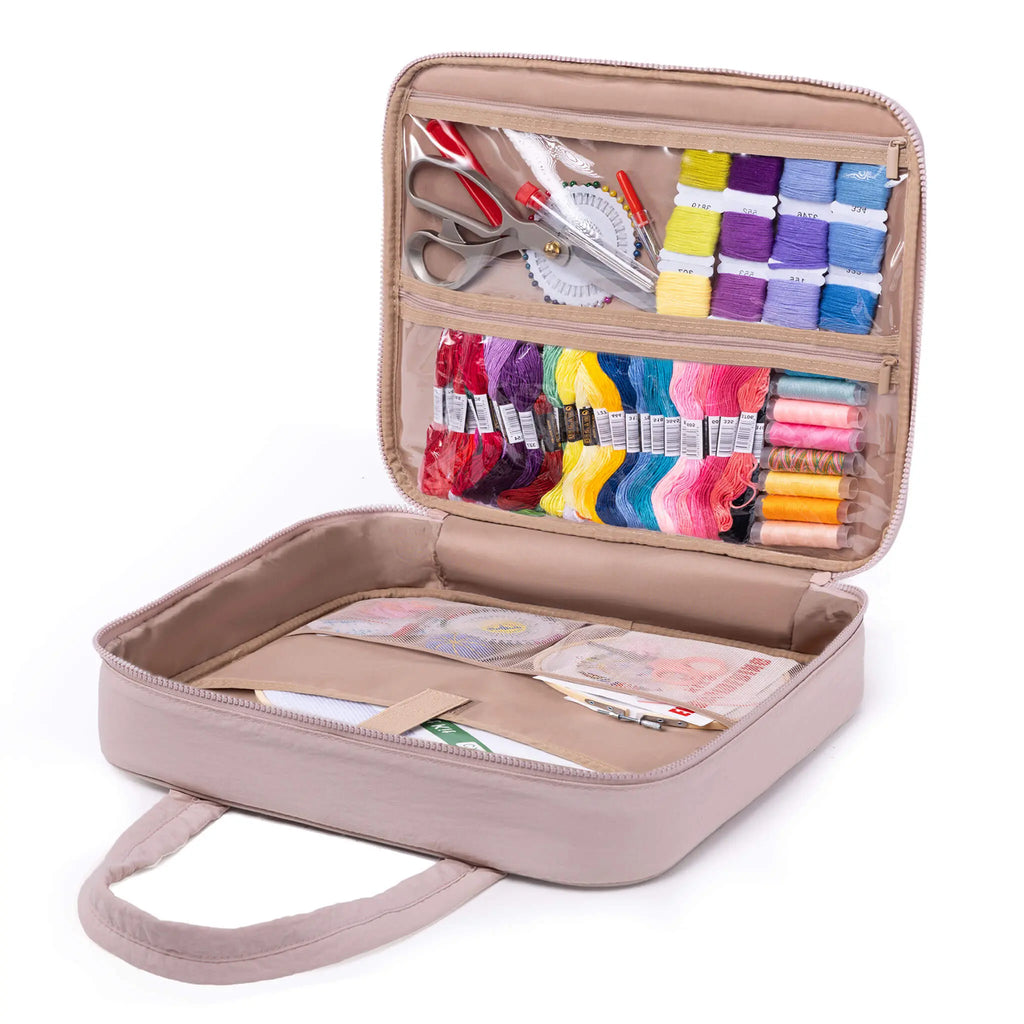 Open Zingcrater embroidery storage bag organizing colorful floss, thread spools, scissors, needles, and patterns