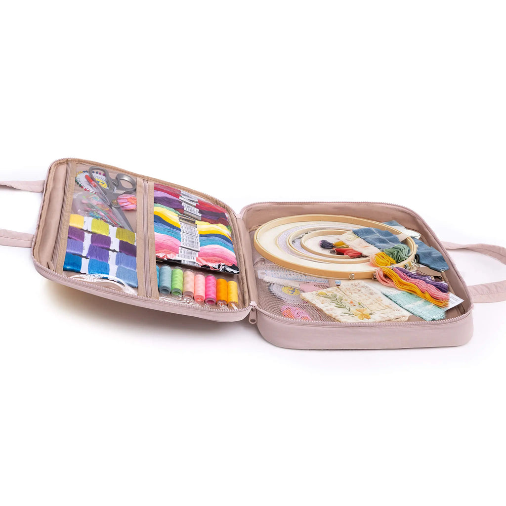 Zingcrater embroidery hoop storage bag holding multiple hoops, floss, thread spools, fabric, and patterns